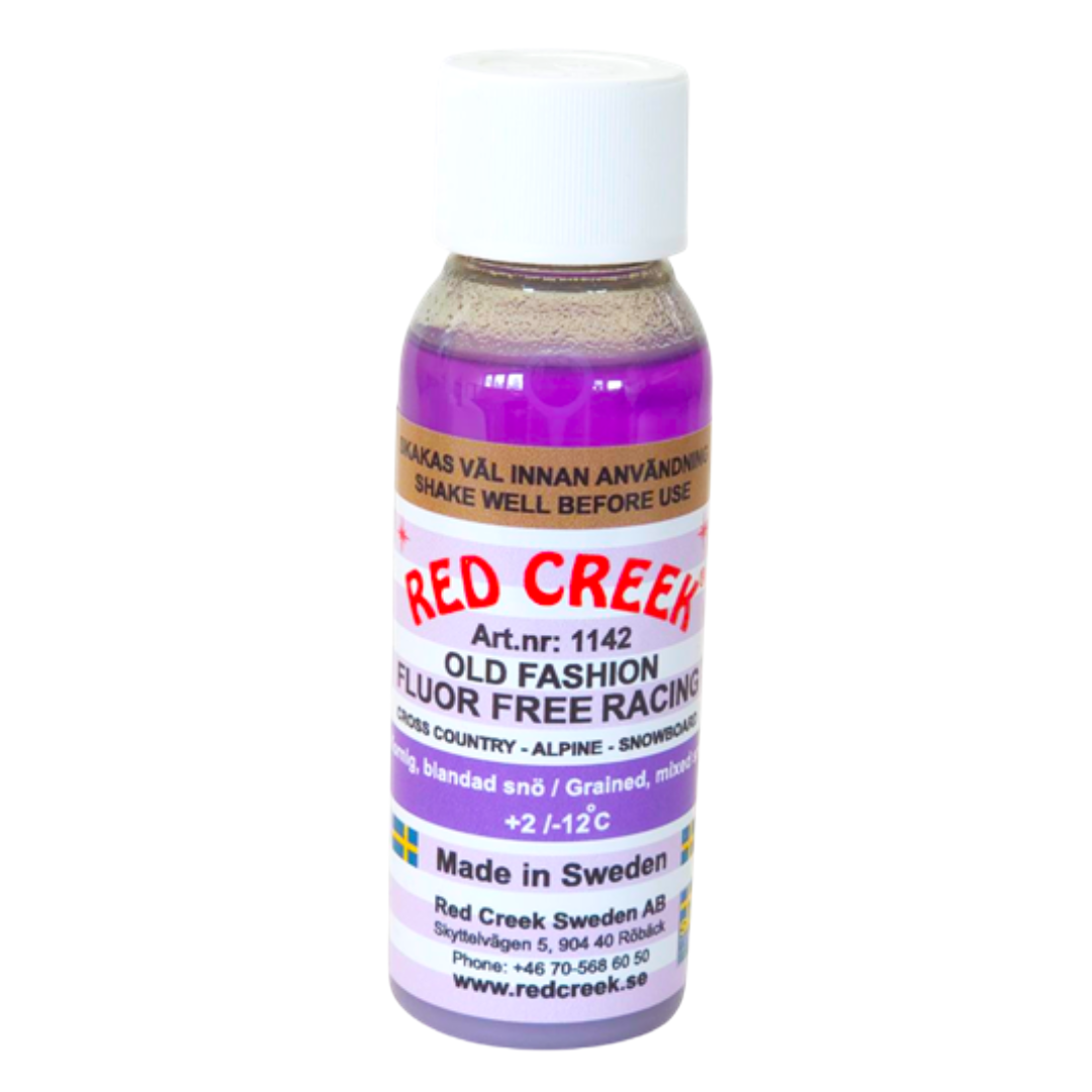 A product picture of the Red Creek Fluoro-Free Violet 'Old Fashion' Grained, Mixed Snow Liquid Glide Wax (2C/-12C) | 90ml